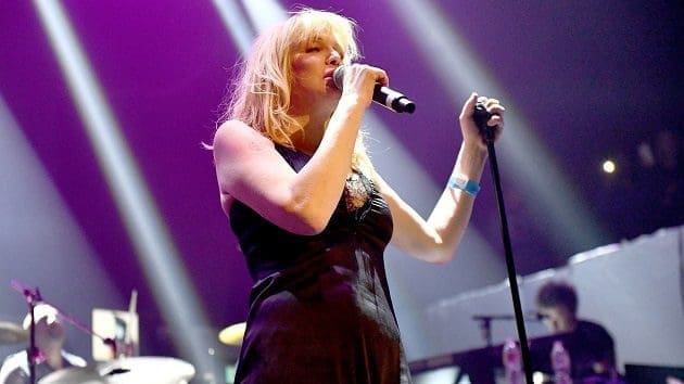 Courtney Love “faked” her way through conversation about Muse with Coldplay’s Chris Martin
